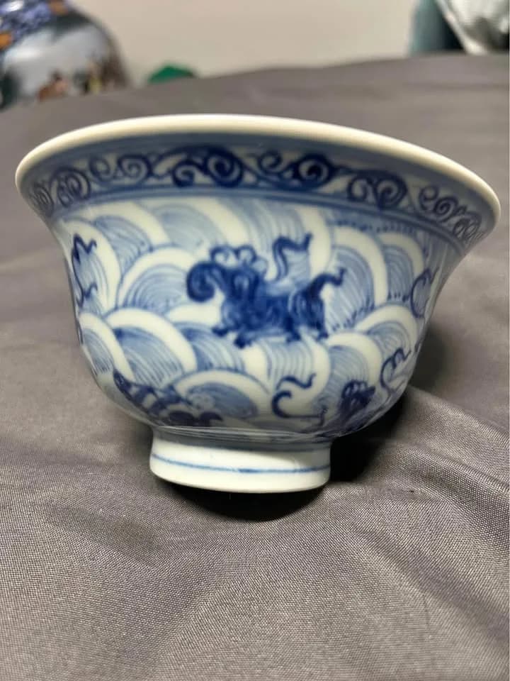 Ming Dynasty Yongle-period Sumali Qing blue-and-white bowl with sea-wave and auspicious beast design